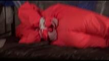 Jill tied, gagged and hooded on a princess bed wearing shiny orange rainwear (Video)