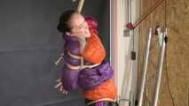 Rachel Adams bound, gagged and double hooded in shiny downjackets