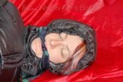 Sonja tied and gagged with ropes and a ball gag wearing a sexy grey shiny nylon rain pants and a black down jacket (Pics)