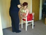 Lady in Red on a chair 1/2