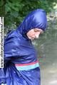 Stella bound outdoor in a blue rainsuit
