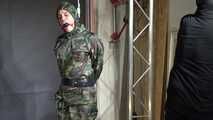 Ms Ungeniert tied and gagged in shiny nylon Rainwear 