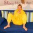 Michelle posing sexy infront of the camera wearing sexy shiny nylon rainwear (Pics)