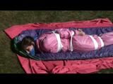 03:50 Min. video with Julia tied and gagged in a shiny pink skisuit