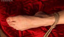 Esther crosstied on bed