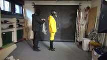 Watch Lady M bound in a yellow Rainsuit wearing a latex Hood and a Gasmask