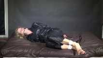 Watching Pia being tied and gagged with ropes and a clothgag wearing sex black shiny nylon suit (Video)