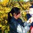 Jill tied and gagged by her friend outside in shiny rainwear