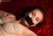 Esther crosstied on bed