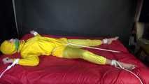 Watching sexy Pia being tied and gagged with ropes on a bed and a clothgag wearing sexy yellow shiny nylon rainwear (Video)