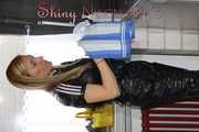 Watching sexy Sonja during her housework wearing a sexy black shiny nylon jumpsuit (Pics)