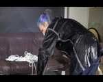 Watching Mara wearing sexy black rainwear during sorting her ropes for the next bondage session (Video)