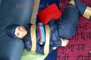 Jill tied, gagged and hooded on the floor with tape wearing an oldschool rain combination (Pics)