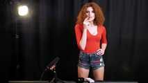 Skinny girl with wild red hair loves smoking a 120mm between the shooting