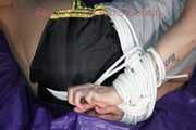 Pia being tied and gagged on a sofa with ropes and a cloth gag wearing a sexy shiny nylon shirts and a tshirt (Pics)