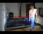 Pia wearing a shiny nylon rain pants and a bra dressing herself with a blue PAMY down jacket and lolling on bed (Video)