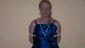 First wearing handcuffs and than totally tied with ropes