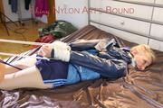 Mara tied and gagged on bed with ropes and a cloth wearing hot shiny nylon shorts and rain jacket (Pics)