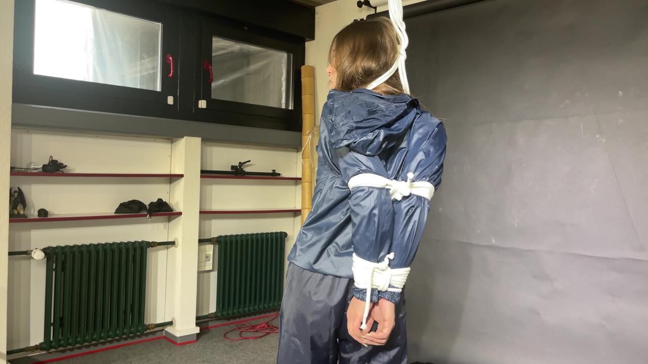 Marie Tied And Gagged In A Very Sexy, Shiny Blue Rainsuit