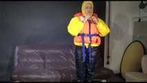 Watching Mara putting on a down jacket, rubber boots and a lifevest (Video)