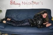 Petra lolling on the sofa wearing a sexy blue rainwear combination (Pics)