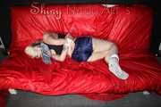 ***COURTNEY***NEW MODELL***being tied and gagged with ropes and a clothgag on a sofa wearing an oldschool blue shorts and a black top trying to get out (Pics)
