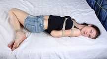 Sally is hogtied