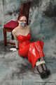 Bound in red PVC dress