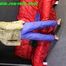 Pia wearing several layers of shiny nylon rainwear (Oics)
