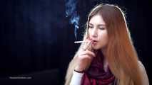 Mysterious girl Valya poses on camera with a tasty 120mm cigarette
