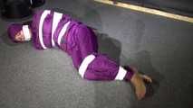 Sexy Sandra wearing a supersexy purple shiny nylon rainsuit bein tied and gagged and hooded on the floor with tape (Video)