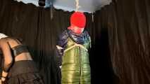 Sebastien with his hands tied behind his back in a puffer winter jacket.