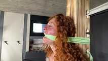 Beautifull Lola Montez tied and gagged very strictly to a post in shiny nylon Shorts