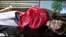 Sonja tied and gagged on bed wearing supersexy shiny nylon shorts and a rain jacket (Video)