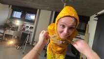 Marie tied and gagged in shiny nylon rainwear