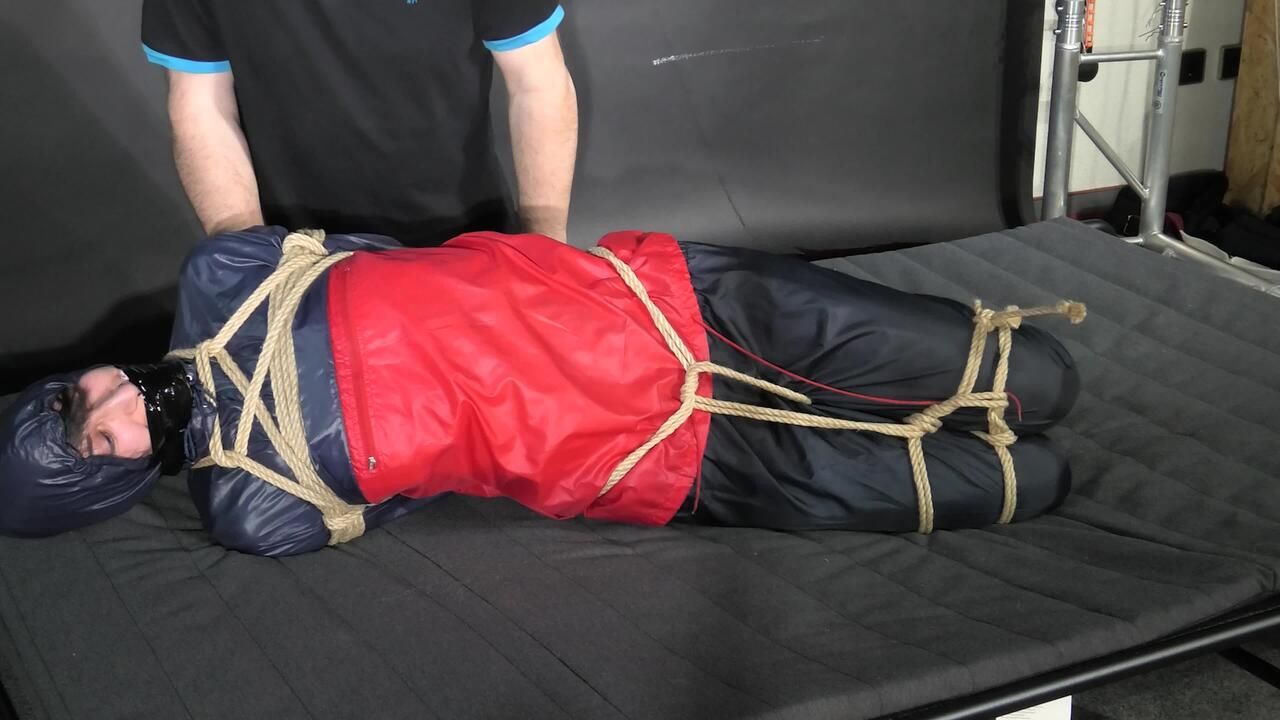 Myxxxy Bound And Gagged In Shiny Nylon Rainwear Trying To Free Herself