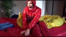Jill ties, gagges and hoodes herself with cuffs wearing a sexy red shiny nylon down jacket and rain pants (Video)