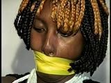 21 Yr OLD BLACK COLLEGE STUDENT GETS MOUTH STUFFED, WRAP TAPE GAGGED WHILE TIED TO A CHAIR  WEARING BLACK LINGERIE, GARTER BELT & HIGH HEELS (D65-4)
