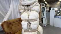 Rey Sanson bound and gagged in a shiny nylon Downjacket during a Fotoshooting