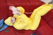 Jill ties, gagges and hoodes herself wearing a shiny yellow down jacket and a yellow rain pants(Pics)