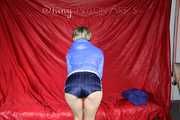 Watching sexy Sonja wearing a supersexy oldschool blue shiny nylon shorts and a lightblue rain jacket during her workout with barbells (Pics)