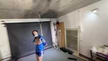 Myxxxy bound and gagged, wearing shiny nylon shorts and a windbreaker