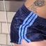 Watching sexy COURTNEY wearing a darkblue shiny nylon shorts and a top while preparing coffee and doing her housework (Video)