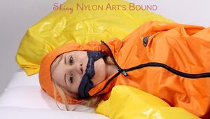 Samantha tied and gagged wearing shiny nylon rainwear (Pics)