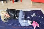 Nina tied and gagged in a shiny downjacket and rainpants