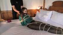 Rachel Adams tied and gagged in shiny Downwear