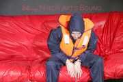 *** HOT HOT HOT*** NEW MODELL*** DESTINY wearing a sexy blue/red shiny nylon rain suit and a life jacket ties and gagges herself with cuffs on a sofa (Pics)
