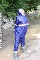 Stella bound outdoor in a blue rainsuit