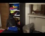 Lucy wearing a supersexy blue shiny nylon shorts and a black rain jacket tyding up the rain clothes (Video)