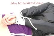 Mara tied and gagged on a white sofa in a reading lounge wearing a sexy purple shorts with shadow stripes and a black rain jacket (Pics)